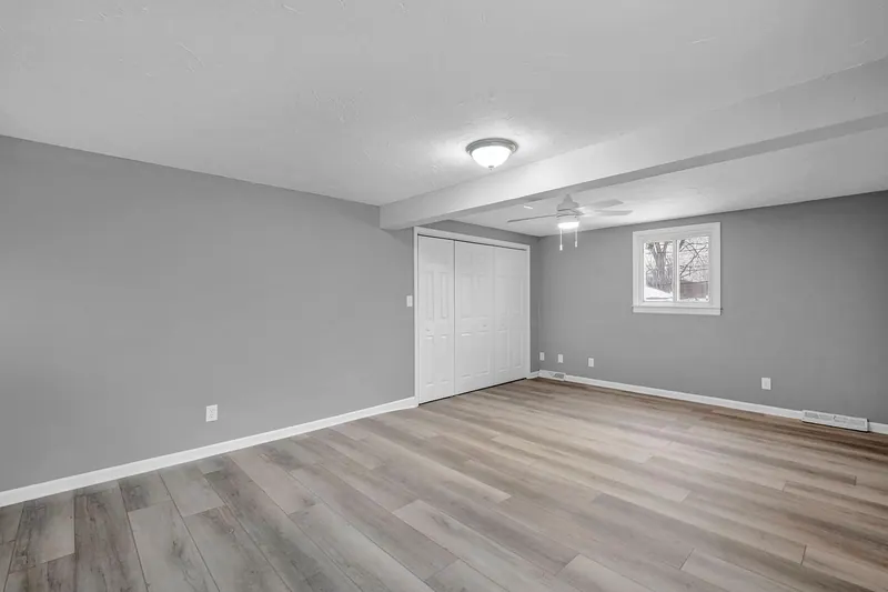 Further room on the main floor, with a door and a high window