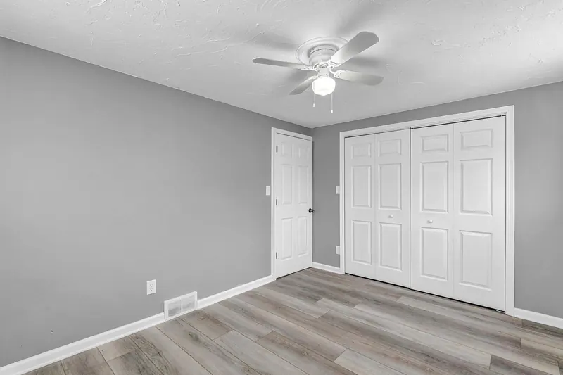 Bedroom with a double closet and a panel door